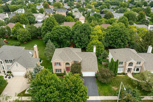 birds eye view of property with a residential view