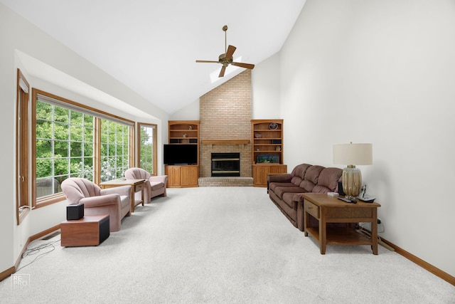 living area featuring baseboards, ceiling fan, carpet, and a brick fireplace