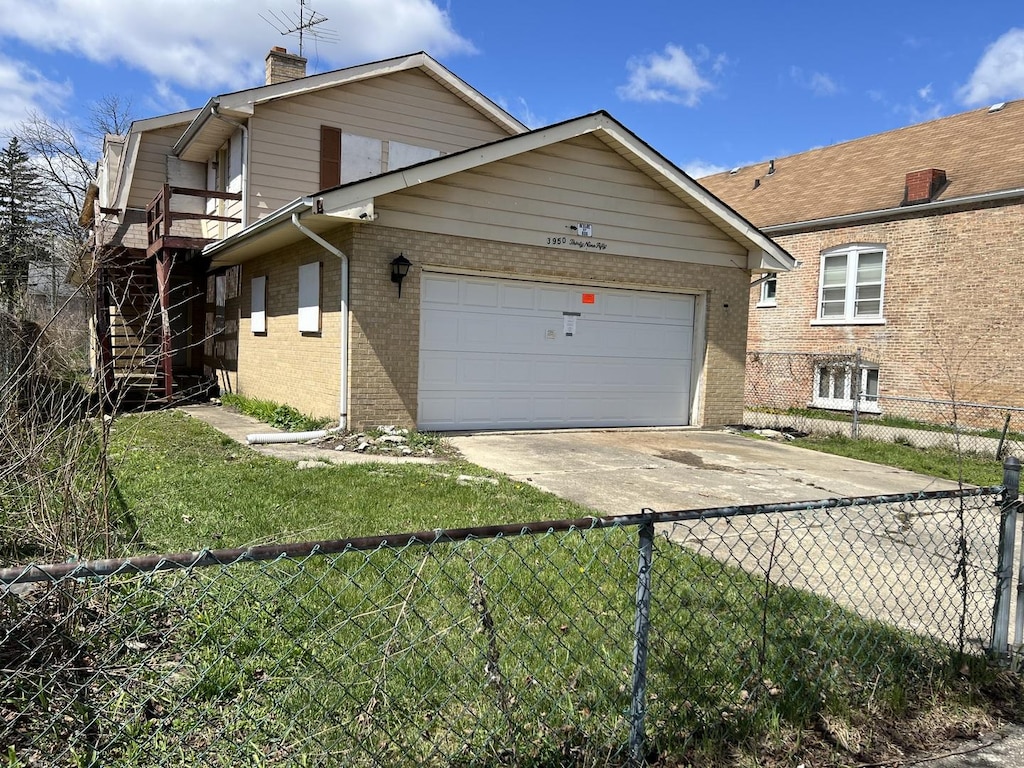 view of front of house with fence, brick siding, an attached garage, a chimney, and concrete driveway