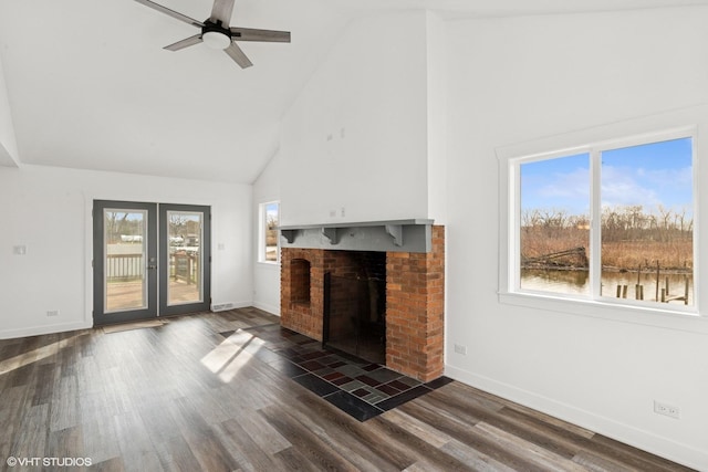 unfurnished living room with a fireplace, baseboards, high vaulted ceiling, and ceiling fan