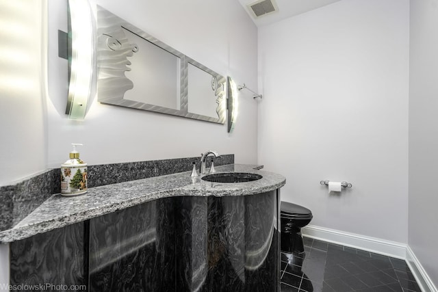 418 Bay Tree Cir, Vernon Hills, IL 60061 - half bathroom with toilet, vanity, baseboards, and tile patterned flooring