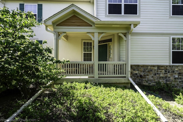 418 Bay Tree Cir, Vernon Hills, IL 60061 - doorway to property with covered porch and stucco siding