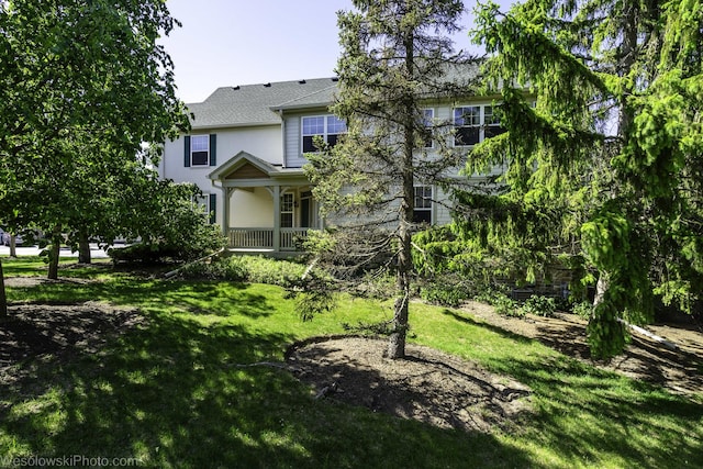 418 Bay Tree Cir, Vernon Hills, IL 60061 - view of front of property with a front lawn, stucco siding, and roof with shingles