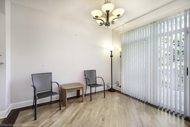 418 Bay Tree Cir, Vernon Hills, IL 60061 - sitting room featuring a chandelier, wood finished floors, and baseboards