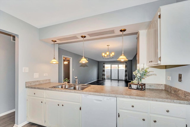 kitchen featuring white cabinets, dishwasher, a sink, decorative light fixtures, and a notable chandelier