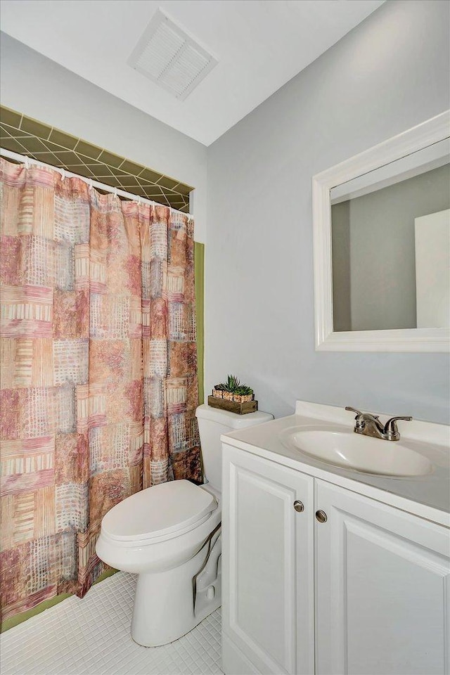 bathroom featuring visible vents, a shower with curtain, toilet, vanity, and tile patterned flooring