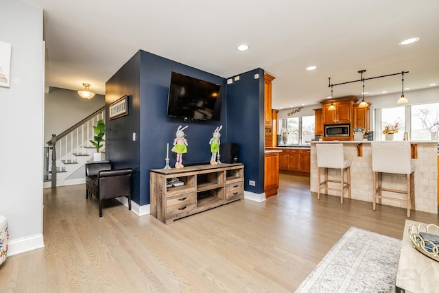 8001 William Dr, Willowbrook, IL 60527 - living room featuring light wood-style flooring, recessed lighting, stairway, and baseboards