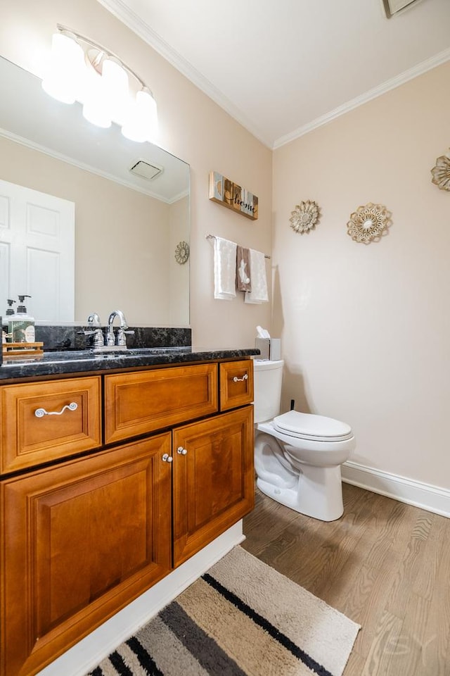 8001 William Dr, Willowbrook, IL 60527 - bathroom with crown molding, vanity, visible vents, toilet, and wood finished floors