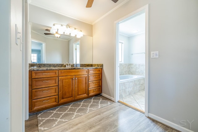 8001 William Dr, Willowbrook, IL 60527 - bathroom with ornamental molding, a ceiling fan, vanity, wood finished floors, and a garden tub
