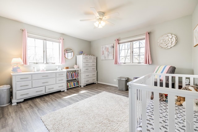 8001 William Dr, Willowbrook, IL 60527 - bedroom with a nursery area, multiple windows, and wood finished floors