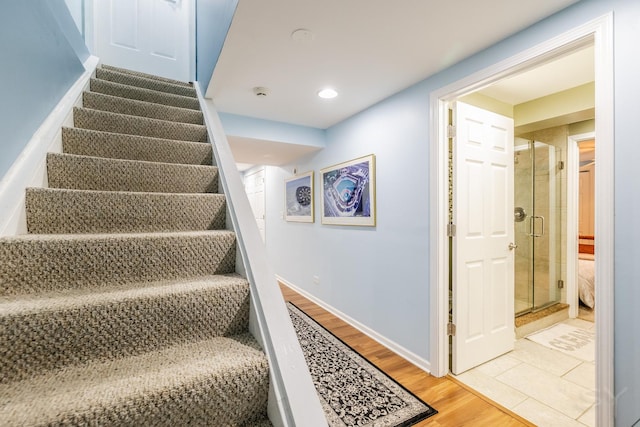 8001 William Dr, Willowbrook, IL 60527 - stairs featuring baseboards, recessed lighting, and wood finished floors