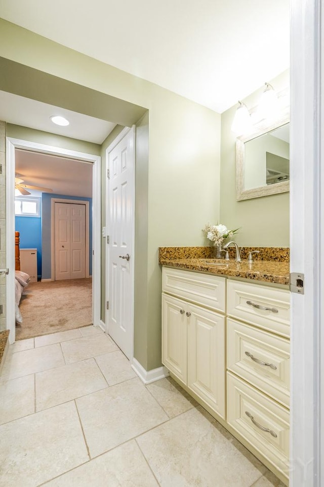 8001 William Dr, Willowbrook, IL 60527 - bathroom with tile patterned floors, vanity, and baseboards