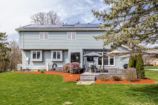 8001 William Dr, Willowbrook, IL 60527 - back of house featuring central AC, roof mounted solar panels, a patio area, and a lawn