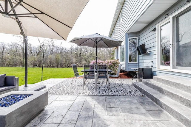 8001 William Dr, Willowbrook, IL 60527 - view of patio featuring outdoor dining space, entry steps, and an outdoor fire pit