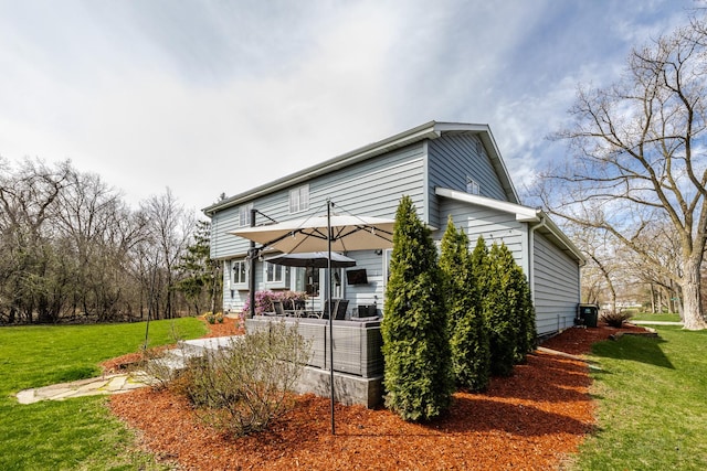 8001 William Dr, Willowbrook, IL 60527 - rear view of property featuring central AC unit and a lawn