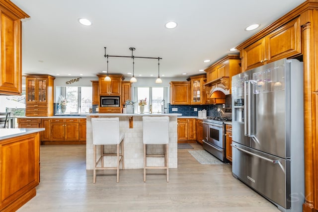 8001 William Dr, Willowbrook, IL 60527 - kitchen featuring brown cabinetry, recessed lighting, appliances with stainless steel finishes, light countertops, and backsplash