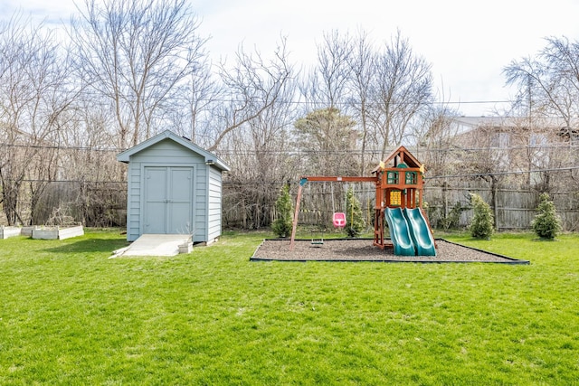 8001 William Dr, Willowbrook, IL 60527 - view of playground featuring a storage shed, an outdoor structure, fence, and a lawn