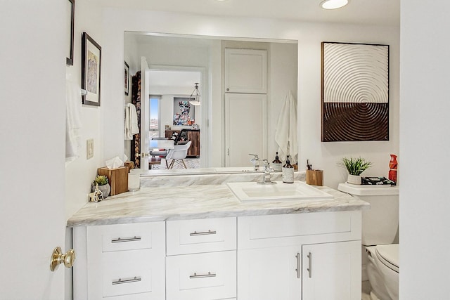 bathroom with vanity and toilet