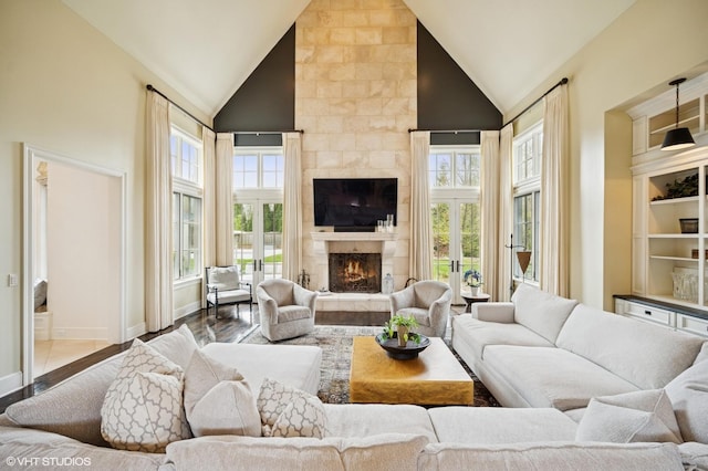 494 Sheridan Rd, Glencoe, IL 60022 - living area with high vaulted ceiling, baseboards, a tile fireplace, and wood finished floors