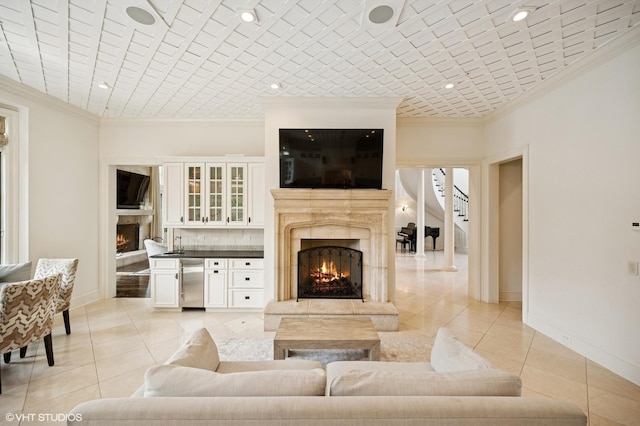 494 Sheridan Rd, Glencoe, IL 60022 - living room with a premium fireplace, ornamental molding, and light tile patterned flooring