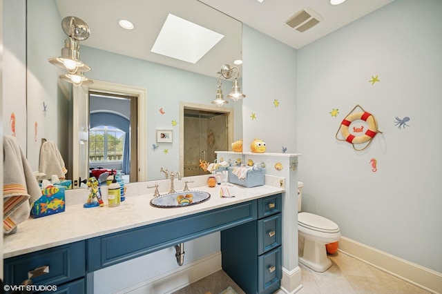 494 Sheridan Rd, Glencoe, IL 60022 - bathroom featuring vanity, visible vents, toilet, tile patterned floors, and a skylight