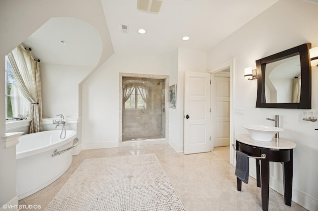 494 Sheridan Rd, Glencoe, IL 60022 - bathroom with a sink, plenty of natural light, a soaking tub, and a stall shower