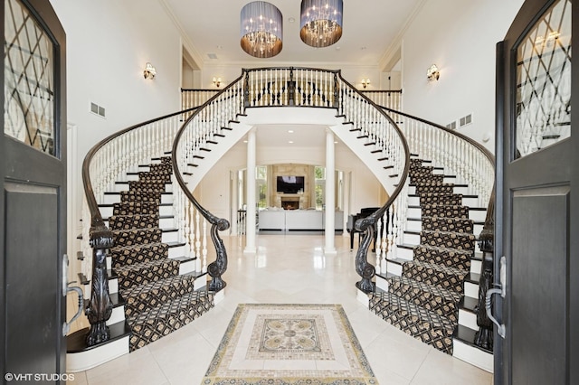 494 Sheridan Rd, Glencoe, IL 60022 - entryway featuring visible vents, ornamental molding, stairway, and a towering ceiling