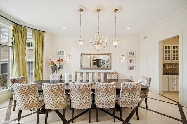 494 Sheridan Rd, Glencoe, IL 60022 - dining room featuring an inviting chandelier, light tile patterned floors, ornamental molding, and visible vents