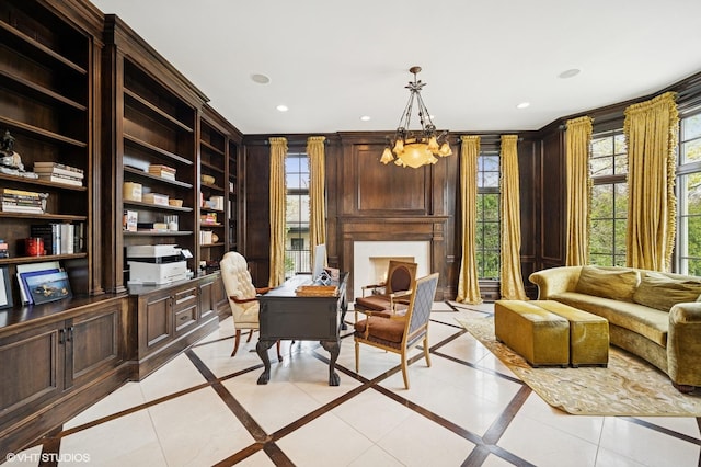 494 Sheridan Rd, Glencoe, IL 60022 - sitting room featuring built in study area, recessed lighting, a chandelier, and a large fireplace