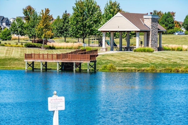 view of dock featuring a water view, a gazebo, and a yard