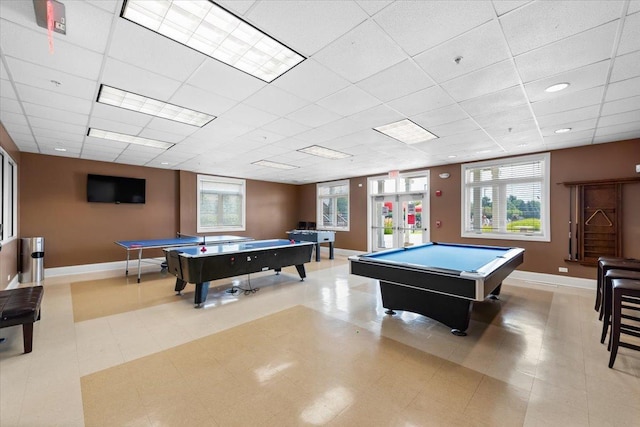 rec room with a paneled ceiling, baseboards, and billiards