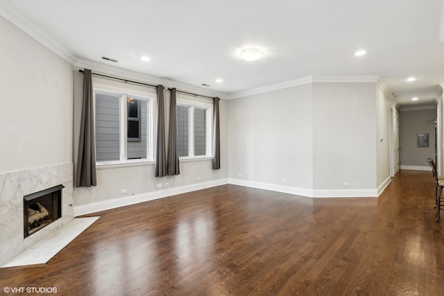 unfurnished living room with visible vents, crown molding, a high end fireplace, recessed lighting, and dark wood-type flooring