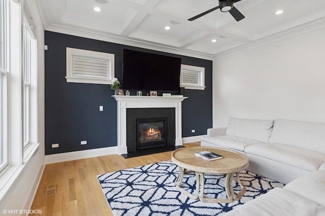 living room featuring a ceiling fan, light wood-type flooring, beamed ceiling, coffered ceiling, and recessed lighting
