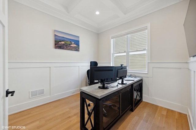 office featuring wainscoting, a decorative wall, coffered ceiling, and visible vents