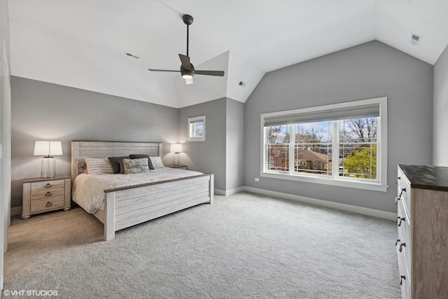 carpeted bedroom with lofted ceiling, a ceiling fan, visible vents, and baseboards