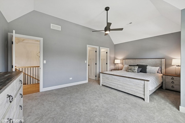 bedroom featuring baseboards, vaulted ceiling, visible vents, and carpet floors