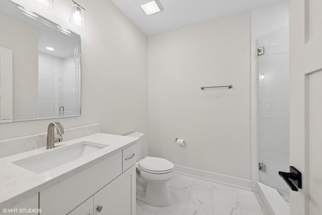bathroom featuring a shower stall, marble finish floor, toilet, vanity, and baseboards