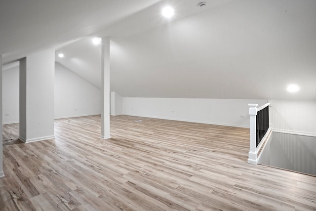 bonus room with wood finished floors, baseboards, lofted ceiling, and recessed lighting
