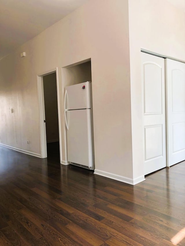 3436 S Wallace St, Chicago, IL 60616 - interior space featuring freestanding refrigerator, dark wood-type flooring, and baseboards