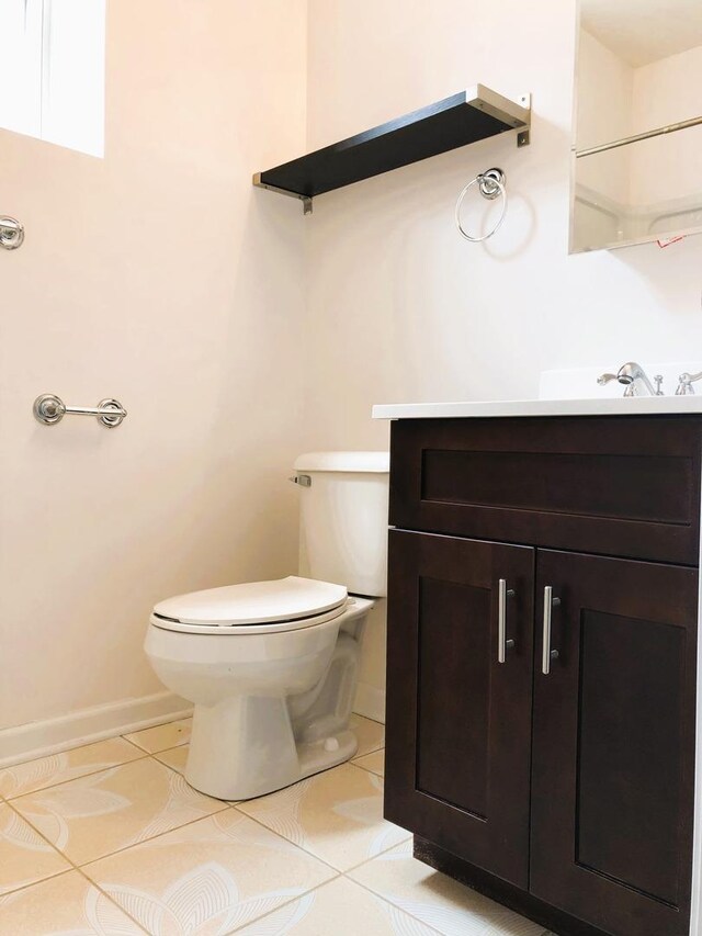 3436 S Wallace St, Chicago, IL 60616 - bathroom with toilet, tile patterned flooring, vanity, and baseboards