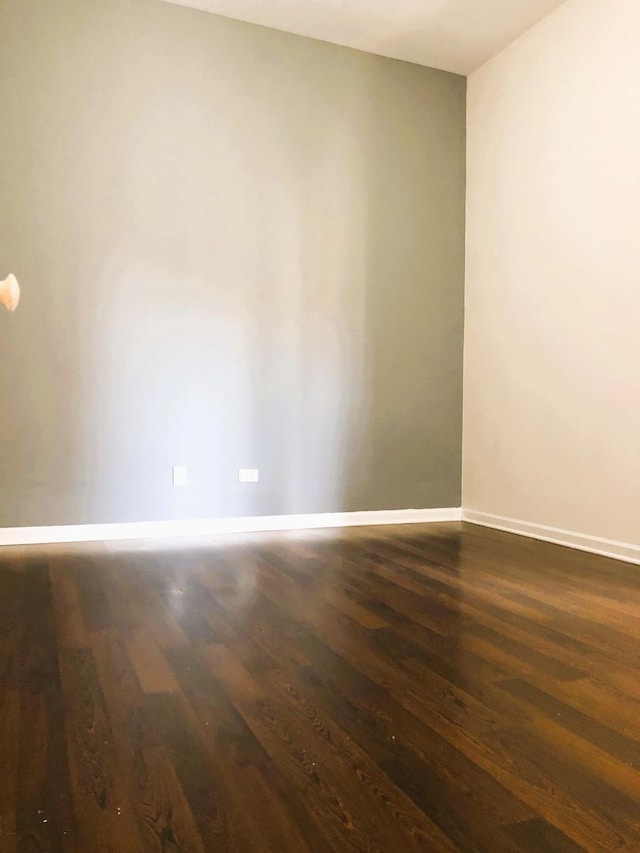 3436 S Wallace St, Chicago, IL 60616 - spare room with dark wood finished floors and baseboards