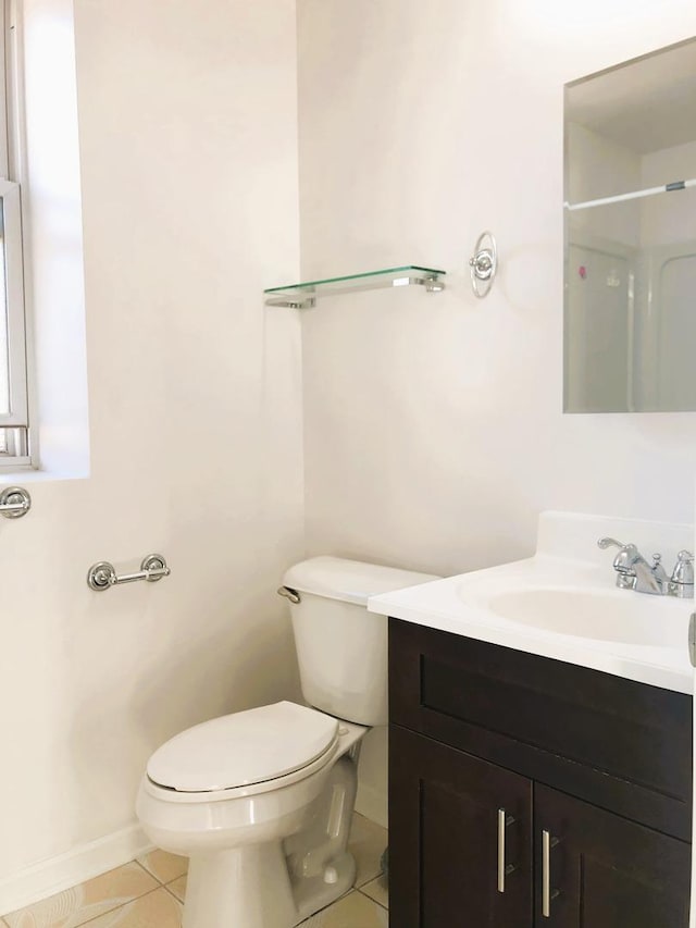3436 S Wallace St, Chicago, IL 60616 - bathroom featuring tile patterned floors, toilet, baseboards, and vanity