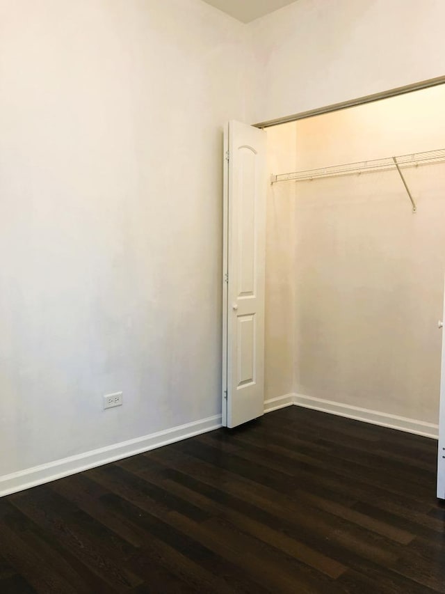 3436 S Wallace St, Chicago, IL 60616 - unfurnished bedroom with baseboards and dark wood-style floors
