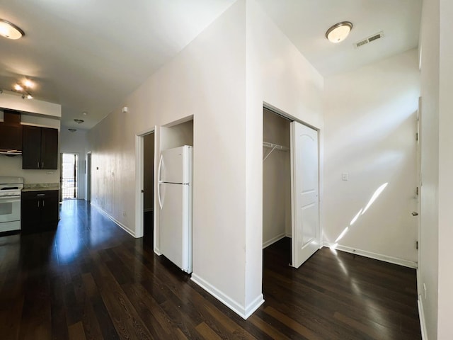 3436 S Wallace St, Chicago, IL 60616 - hallway featuring baseboards, visible vents, and dark wood-type flooring