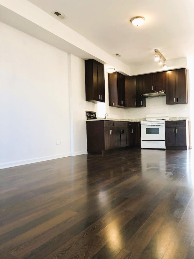 3436 S Wallace St, Chicago, IL 60616 - kitchen featuring gas range gas stove, visible vents, dark wood-type flooring, dark brown cabinetry, and light countertops