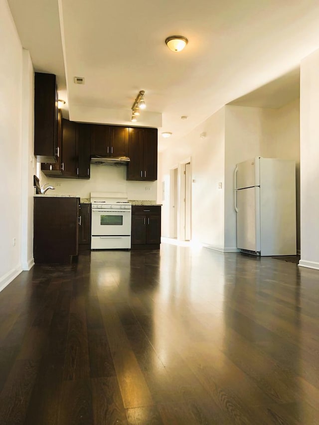 3436 S Wallace St, Chicago, IL 60616 - kitchen featuring dark brown cabinets, dark wood-type flooring, baseboards, white appliances, and light countertops