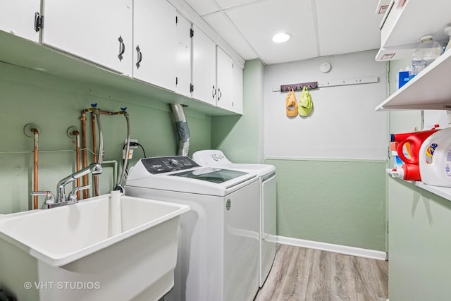 403 E Amherst St, Palatine, IL 60074 - laundry area with independent washer and dryer, cabinet space, a sink, baseboards, and light wood-style flooring