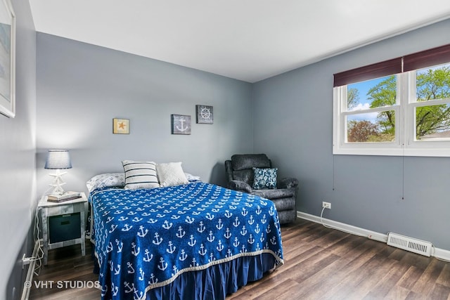 403 E Amherst St, Palatine, IL 60074 - bedroom with baseboards, visible vents, and wood finished floors