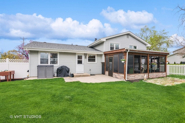 403 E Amherst St, Palatine, IL 60074 - rear view of property featuring roof with shingles, a sunroom, a fenced backyard, a yard, and a patio