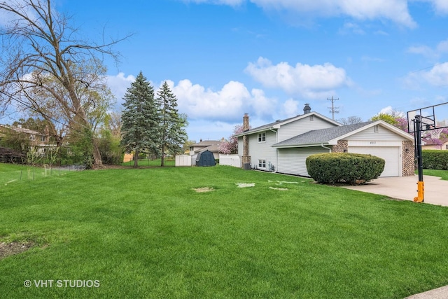 403 E Amherst St, Palatine, IL 60074 - view of yard with concrete driveway, an outbuilding, a shed, and a garage